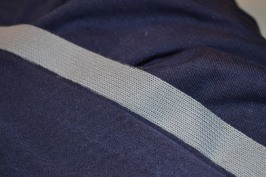 Iron on stretch interfacing to prevent a wibbly hem